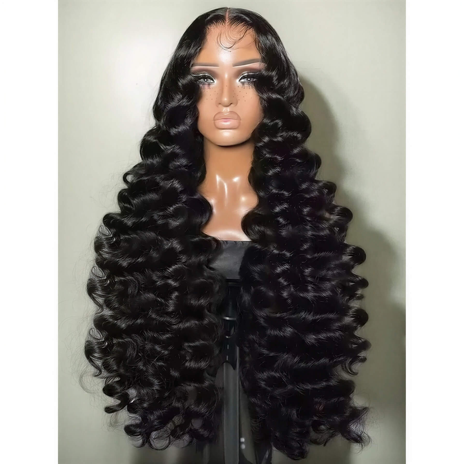 300 density loose wave HD lace wig in deep black with defined curls, displayed on a mannequin against a neutral background.