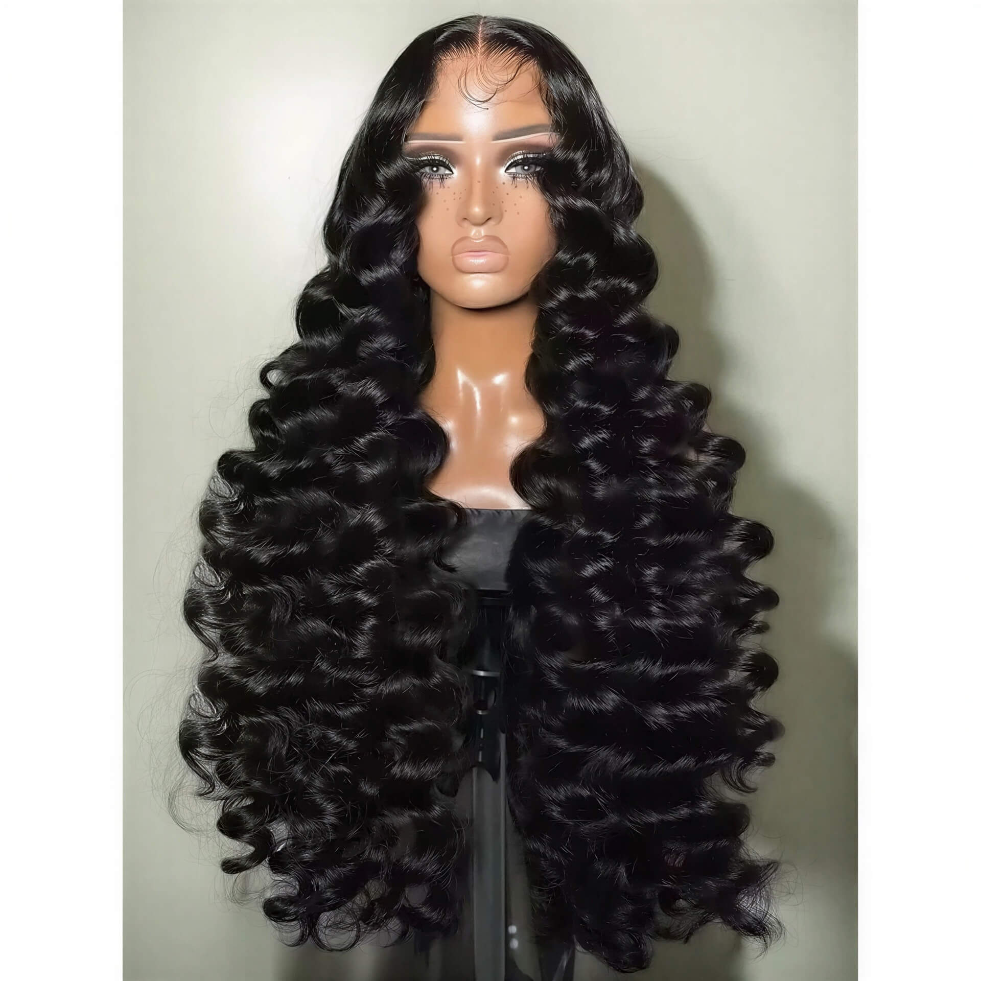 300 density loose wave HD lace wig displayed on a mannequin, featuring long, voluminous black curls.