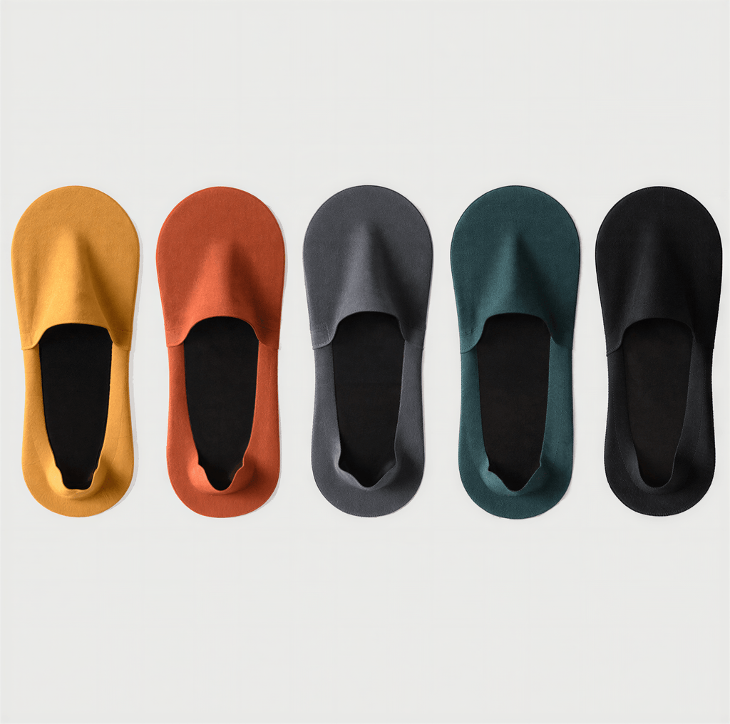 Air Tech Comfort Socks displayed in five colors: mustard yellow, rust orange, charcoal gray, teal green, and black.