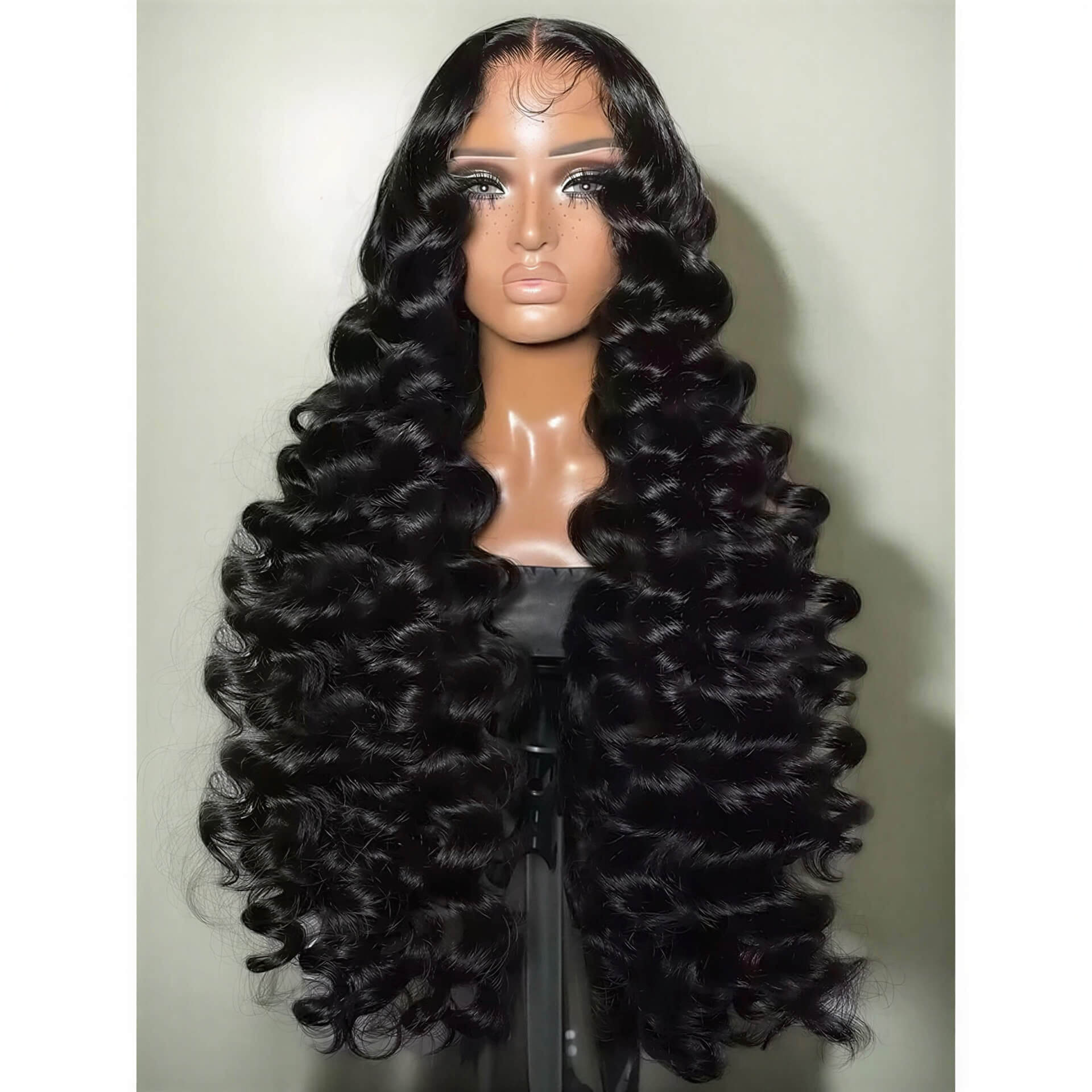 300 density loose wave HD lace wig with long, shiny black curls displayed on a mannequin head.